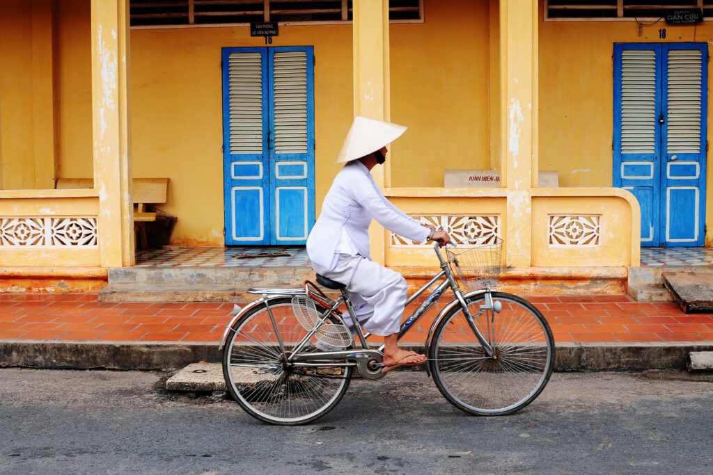 Vietnamese woman rides her bicycle