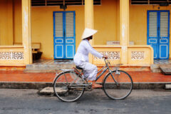 Vietnamese woman rides her bicycle