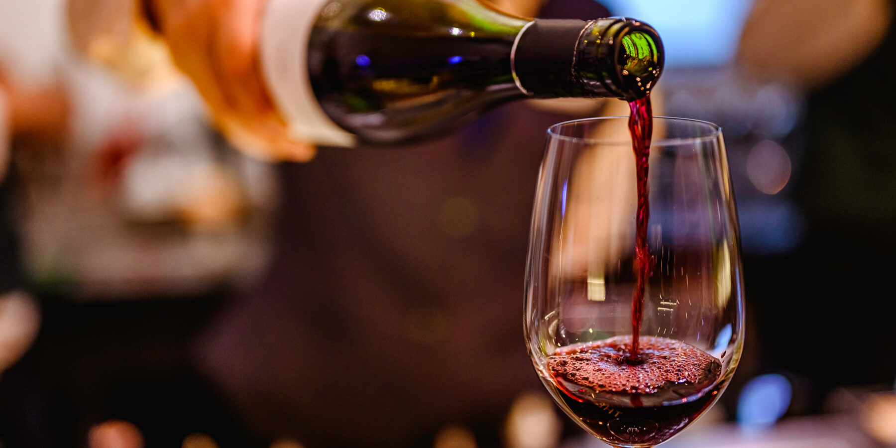 Pouring,Glass,Of,Red,Wine,From,A,Bottle.
