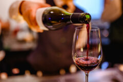 Pouring,Glass,Of,Red,Wine,From,A,Bottle.