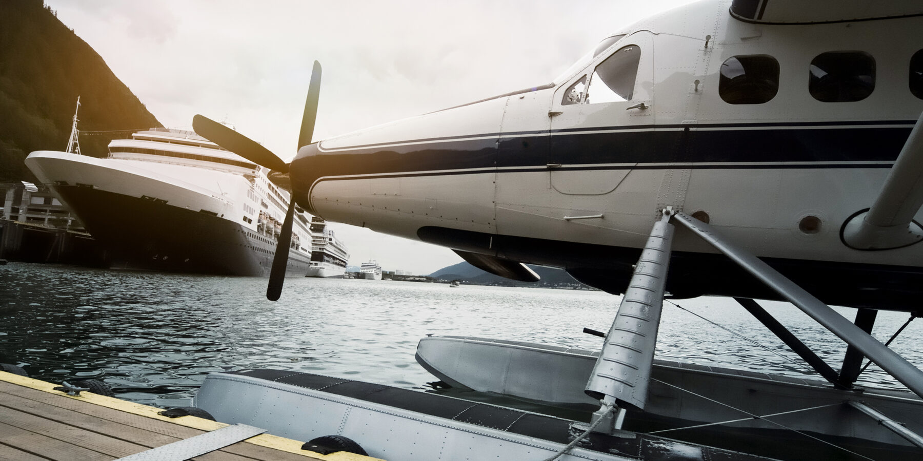 Seaplane,And,Cruise,Ships,Docked,Along,The,Pier,In,Juneau,