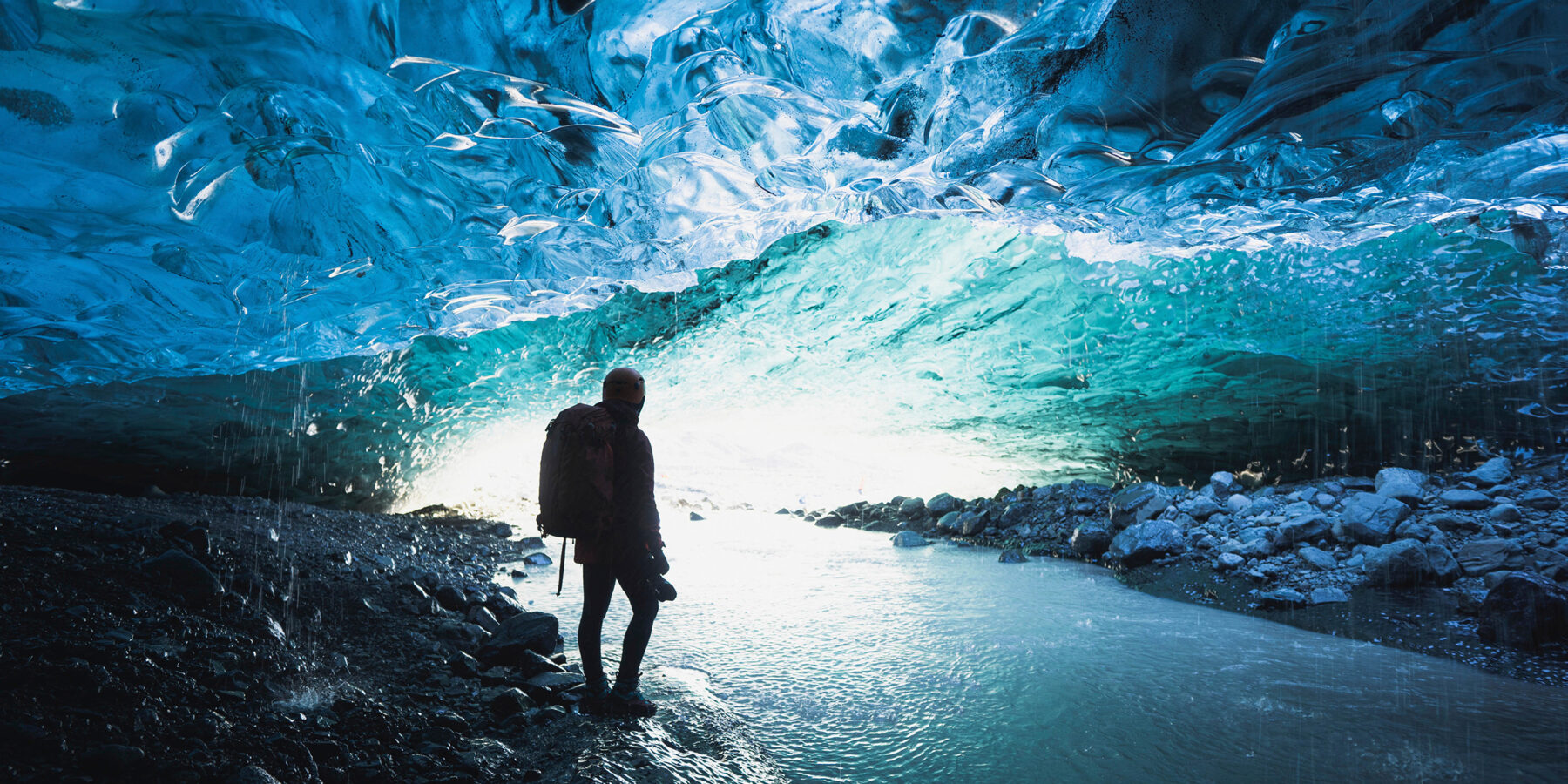 Female,Photographer,In,The,Ice,Cave,,Iceland
