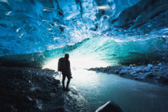 Female,Photographer,In,The,Ice,Cave,,Iceland