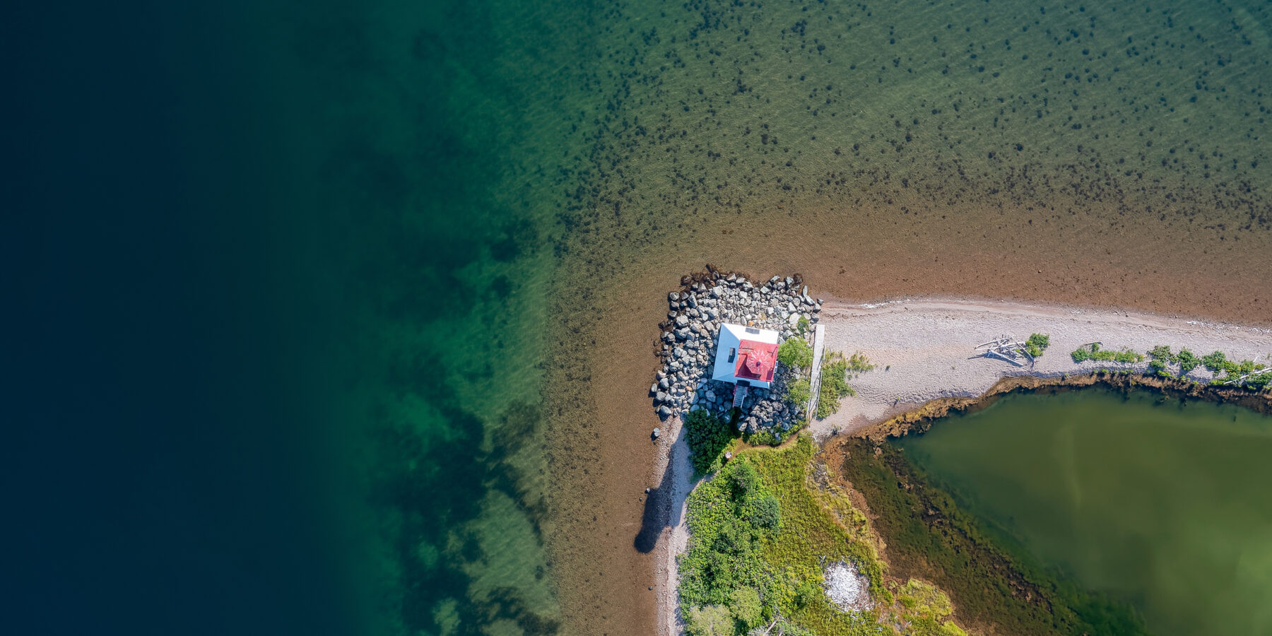 Aerial,View,Of,The,Lighthouse,On,Bras,D’or,Lake,Near