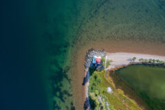 Aerial,View,Of,The,Lighthouse,On,Bras,D’or,Lake,Near