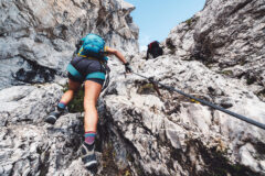 View,From,The,Back,Looking,Up,At,Woman,Mountaineer,In