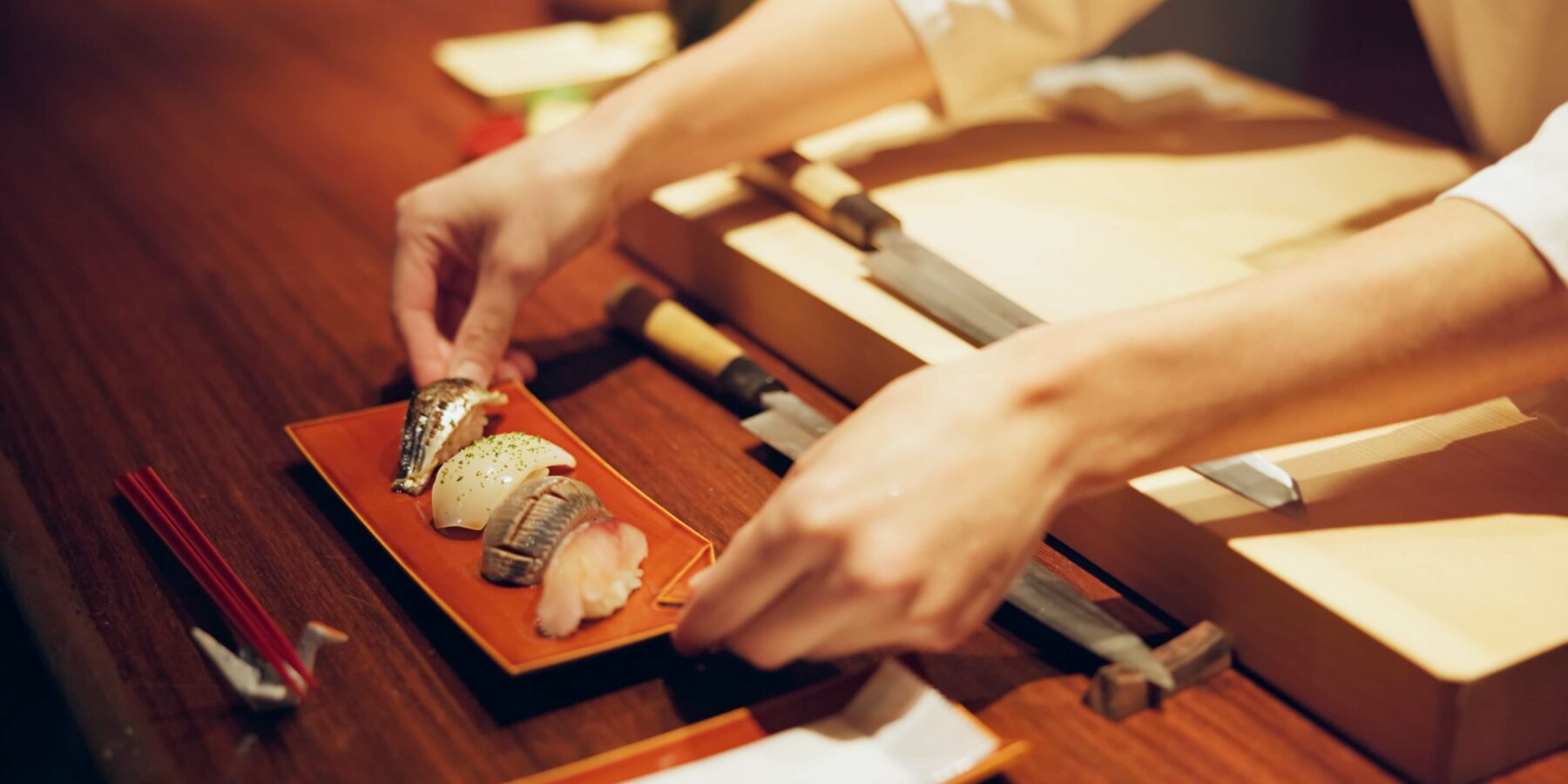 Hands,,Cooking,And,Chef,Serving,Sushi,In,Restaurant,For,Traditional