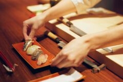 Hands,,Cooking,And,Chef,Serving,Sushi,In,Restaurant,For,Traditional