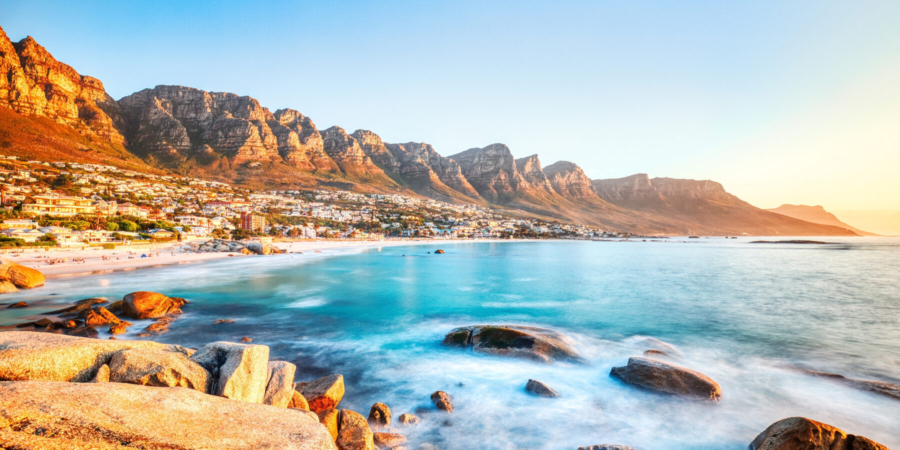 Cape,Town,Sunset,Over,Camps,Bay,Beach,With,Table,Mountain