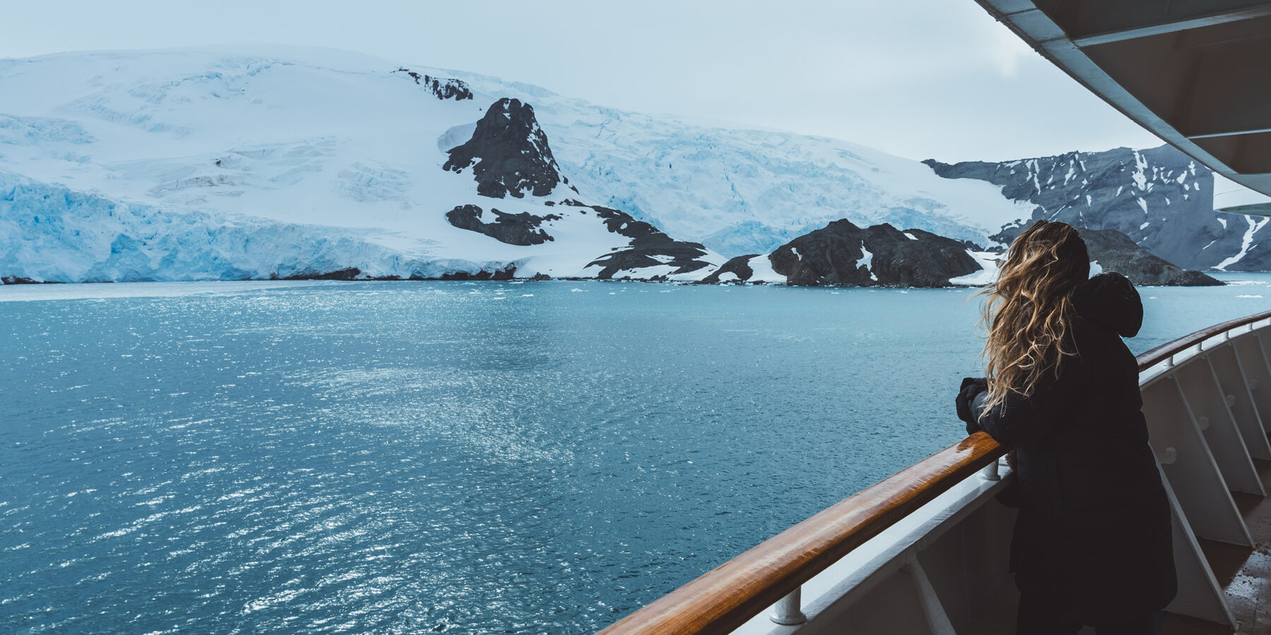 Antarctica,Cruise,Passenger,Views,Glacier.,Beautiful,Girl,Hair,Blowing,In