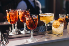 Bartender,Working,,Beautiful,Row,Line,Of,Different,Coloured,Liquor,Alcohol