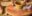 Two,Women,Work,On,A,Pottery,Wheel,,One,Pedaling,The